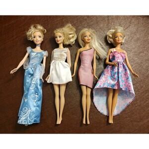 Lot of 4 Barbie Dolls